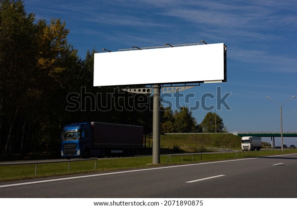 Large white billboards for outdoor advertising\
along the roads