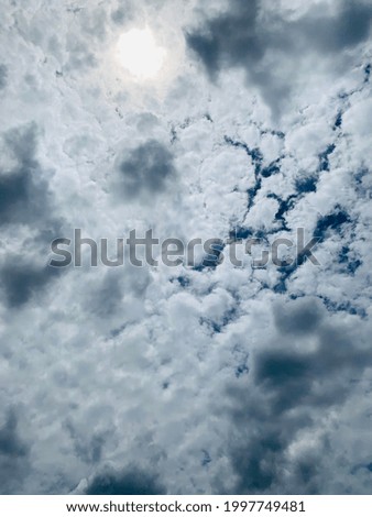 A large white Cirrocumulus clouds hovering in the air In the blue sky at Bangkok, Thailand. Nofocus