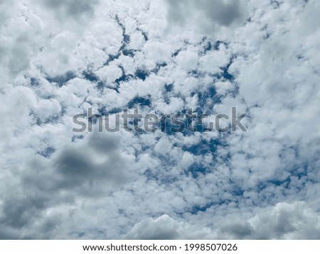 A large white Cirrocumulus clouds hovering in the air In the blue sky at Bangkok, Thailand. Nofocus