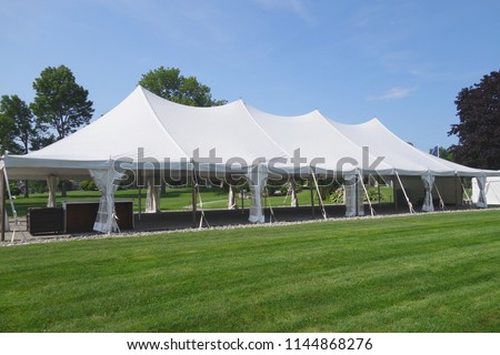 large white events or wedding tent on a summer's day 