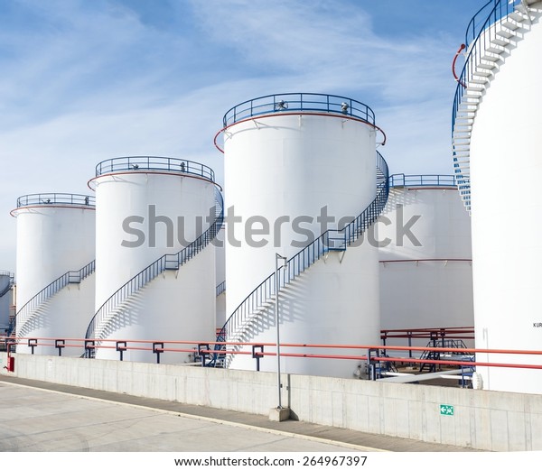 large white\
Industrial tanks for petrol and\
oil