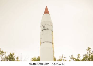 large white missile with red tip