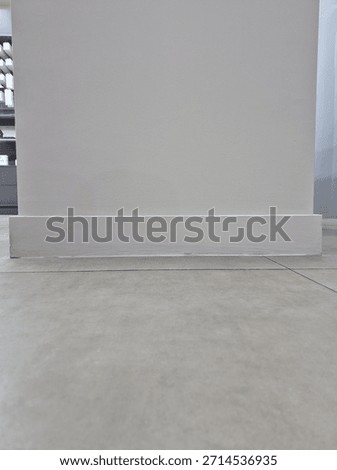 Large white pillar with clean surface design used as structural support in modern building architecture