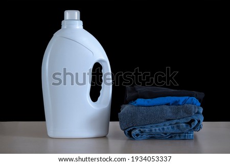 Similar – Image, Stock Photo Fabric softener | black and yellow laundry wafting fragrant in alleyway