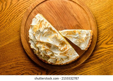 Large White Souffle Cake, Airy With Caramel, On A Round Wooden Stand