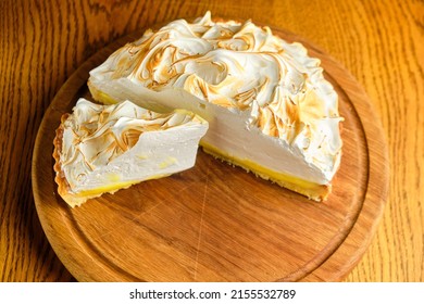 Large White Souffle Cake, Airy With Caramel, On A Round Wooden Stand