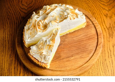 Large White Souffle Cake, Airy With Caramel, On A Round Wooden Stand