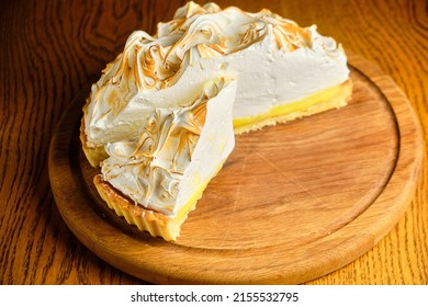 Large White Souffle Cake, Airy With Caramel, On A Round Wooden Stand