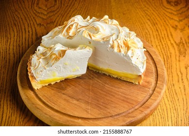 Large White Souffle Cake, Airy With Caramel, On A Round Wooden Stand