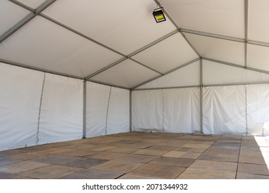 Large white wedding or entertainment event tent interior view