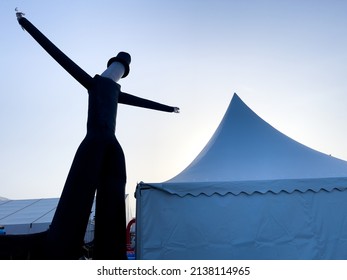 A Large White Wedding Tent Set Up Outside For A Catered Event