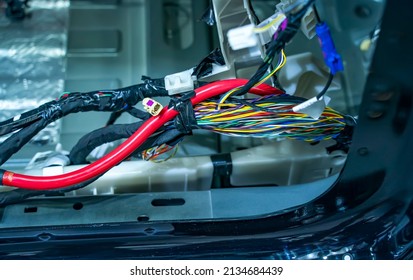 Large wide cable with wires and connectors and terminals in the wiring repair shop and electricians for connecting   - Shutterstock ID 2134684439
