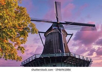 Large windmill seen from below during a beautiful purple sunset.
Traditional dutch windmill in Netherlands.