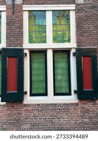 large window with red shutters
