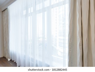 Large window in the room with tulle and curtains. Modern interior - Shutterstock ID 1812882445