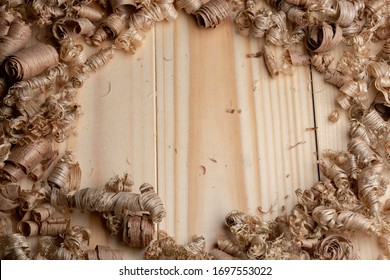 Large wood planer shavings background. Wood shavings of different sizes from woodworking.