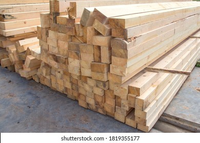 Large wooden beams for construction. Building material. Sawed beam