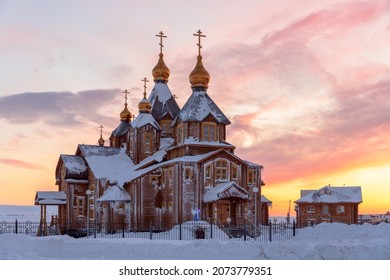 Large wooden cathedral. A beautiful Orthodox church in the Far North of Russia in the Arctic. Cold winter weather. Snowdrifts in the yard and snow on the roof of the building. Anadyr, Chukotka, Russia - Shutterstock ID 2073779351