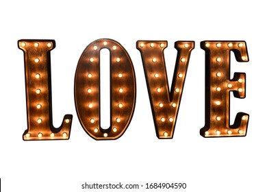large wooden glowing letters forming the word LOVE on a white background