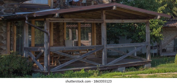 Large Wooden Veranda By The Wall Of The Log House