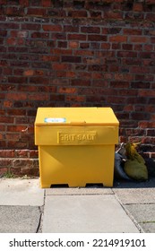 Large Yellow Grit Salt Container On Pavement Sidewalk