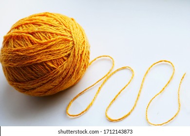 Large Yellow Tangle Of Yarn On A Bright Background Close-up