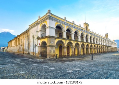 Large yellow and white Baroque style building in Antigua, guatemala.  Located in the main square of Antigua's old town.