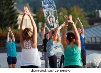 Large Yoga Class Stretching Arms Up.  Saint-Gervais Mont-Blanc. France.  10-30-2017