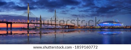 Large-format panorama with cable-stayed bridge and stadium on the background of sunset in Saint Petersburg