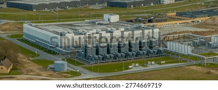 Large-scale data center facility with cooling units, robust power system, and interconnected pipelines that ensure optimal server performance. Digital storage and scalable cloud computing environment.