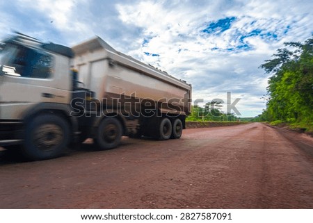 Large-scale open-pit mining operation utilizing advanced excavators and haul trucks, demonstrating efficient material handling, operational excellence, productivity, and sustainable mining practices
