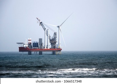 The largest wind farm installation vessel in the world and the first turbine installed off the coast of Aberdeen. Balmedie, Aberdeenshire, Scotland, UK. April 11th 2018