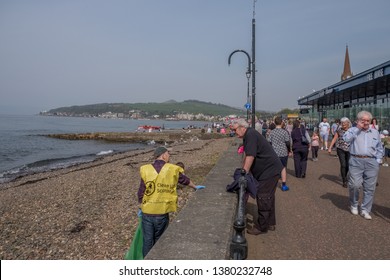 Largs, Scotland, UK - April 20, 2019: Largs Pier And The Volunteer Beach Cleaners From Clean Up Scotland Who Remove Litter And Other Waste From The Beaches.