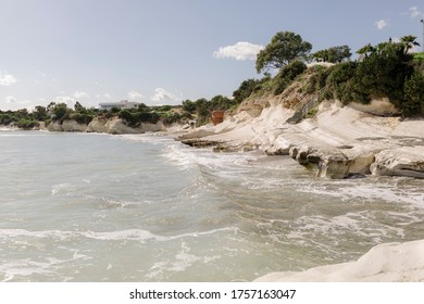 Larnaca, Cyprus Beach View With White Rocks And Palm Trees