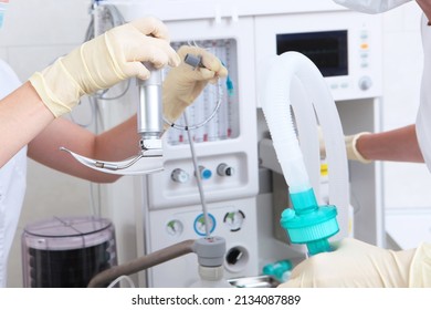 Laryngoscope For Emergency Medical Care In The Hands Of A Doctor. Tracheal Intubation. Surgery Under General Anesthesia. A Device For Artificial Lung Ventilation. Oxygen Mask.Modern Medicine.