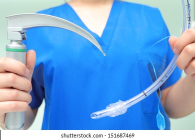 Laryngoscope and intubation tube in the hands ofdoctor