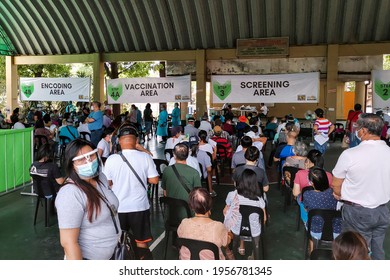 Las Pinas, Metro Manila, Philippines - April 2021: People Line Up At An Open Court To Receive Their First Dosage Of The Covid-19 Vaccine.