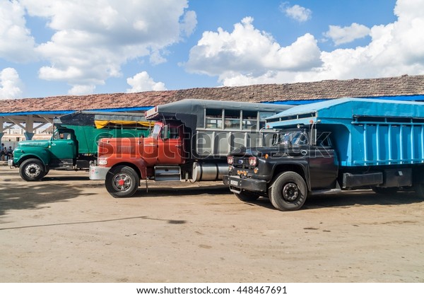 LAS TUNAS, CUBA - JAN 27,\
2016: Truck station in Las Tunas. In Cuba, trucks often carry\
passengers.