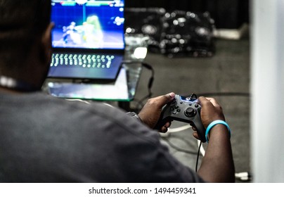 LAS VEGAS - AUGUST 3, 2019: Attendee playing a prototype video game at eSports tournament EVO 2019 Evolution Championship Series at Mandalay Bay Events Center.