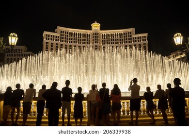 LAS VEGAS - CIRCA JULY 2014: People watching famous water fountain show at Bellagio