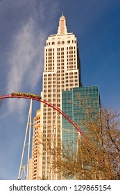 LAS VEGAS - JANUARY 7: A Roller Coaster Speeds Past The Replica Empire State Building At The New York, New York Hotel And Casino In Las Vegas On January 7, 2013.