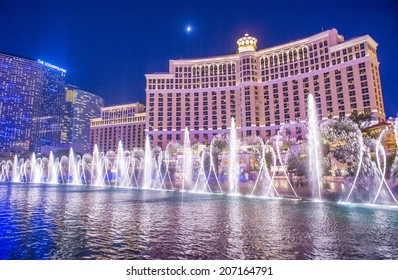 LAS VEGAS - JULY 03 : Bellagio hotel and the dancing fountains in Las Vegas on July 03 2014. Bellagio is a luxury hotel and casino located on the Las Vegas Strip. The Bellagio opened on 1998.