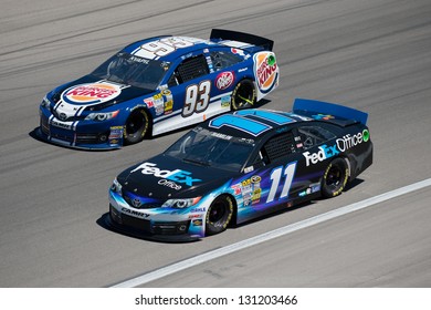 LAS VEGAS - MAR 10: Denny Hamlin Leads Travis Kvapil At The Nascar Kobalt 400 In Las Vegas, NV On Mar 10, 2013