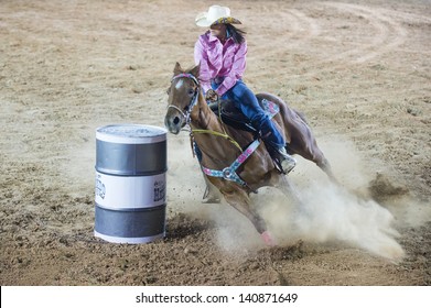 LAS VEGAS - MAY 17 : Cowgirl Participant in a Barrel racing competition at the Helldorado Days Professional Rodeo in Las Vegas , USA on May 17 2013