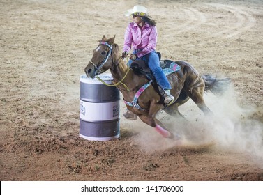 LAS VEGAS - MAY 17 : Cowgirl Participant in a Barrel racing competition at the Helldorado Days Professional Rodeo in Las Vegas , USA on May 17 2013