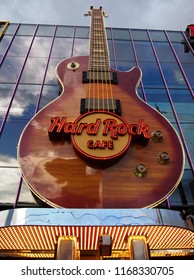 LAS VEGAS, NEVADA - JULY 21, 2018: The Giant, Larger Than Life Guitar Attached To Front Of The Glass Building Serves As The Sign For The Hard Rock Cafe In Las Vegas, Nevada.  