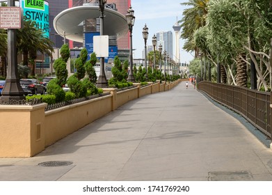 Las Vegas, Nevada / United States - May 22, 2020: A Father And Son Walking On An Empty Side Walk From The Palazzo Resort On A Friday Afternoon. 