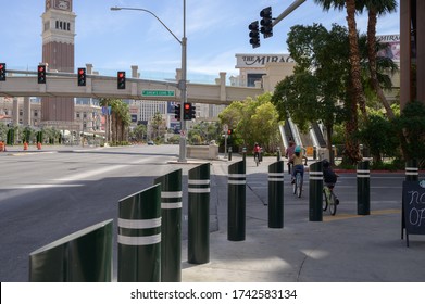 Las Vegas, Nevada / United States - May 22, 2020: People Riding Their Bikes On An Empty Las Vega Strip In The Middle Of The Day. 