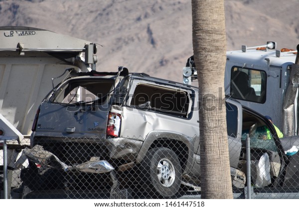 Las Vegas,\
Nevada / United States -  July 25, 2019: Traffic Collision between\
trailer truck and SUV on Las Vegas Blvd. North, adjacent to Las\
Vegas Speedway, North of Nellis AFB.\
