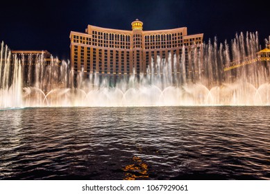Las Vegas, Nevada, USA - December 29, 2017 : The Fountains of Bellagio at night. This feature performs choreography with water, music and light in front of the Bellagio hotel and casino.